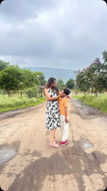 Printed dress styled outdoors, from The Naari Closet Instagram